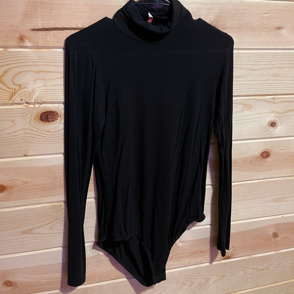 Black turtle neck body suit
